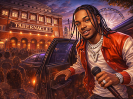 Indakno caricature illustration of Dei V, in an Atlanta scene: The Tabernacle at 152 Luckie Street NW in downtown Atlanta, inside the Luckie-Marietta concert corridor, image rol...